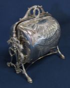 Victorian silver plated muffin warmer with decorative lion's head frame and hairy paw feet