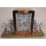 Art Deco marble striking clock flanked by two squirrels Ht 23 L 38cm