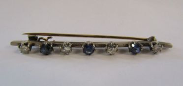 Tested as 18ct gold bar brooch with diamond and spinel stones total weight 4.0g