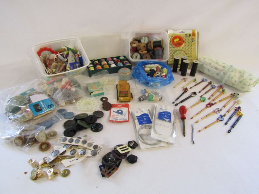 Collection of sewing items to include lace making bobbins, buttons, thread etc