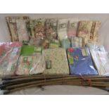 Large collection of curtains and a couple of duvet covers also a set of drain rods
