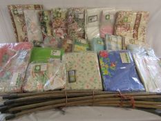 Large collection of curtains and a couple of duvet covers also a set of drain rods