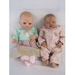 2 Reborn baby dolls 20" weighted doll with painted hair and open blue eyes and 19" weighted doll