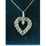 Cased 9k gold necklace with heart shaped pendant set with emeralds and diamond - total weight 2.4g