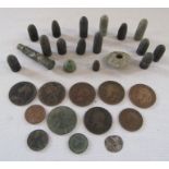 A collection of metal detecting finds to include weights, bullets and coins
