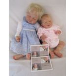 2 Reborn baby dolls - 21" weighted doll with closed eyes and pale blonde hair and an 18" limited