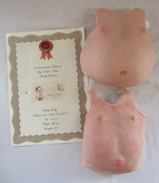 A spare certificate and 2 reborn baby body plates