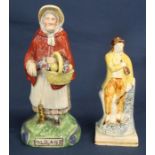 19th century Staffordshire pearlware figure depicting "Old Age" as an elderly lady with walking