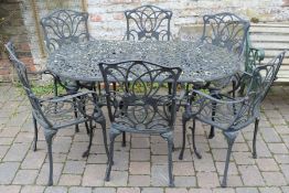 Cast alloy patio table with 6 chairs & cushions