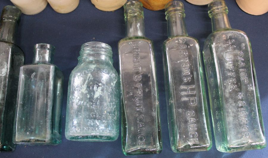 Large selection of salt glazed bottles, 2 large brown glass bottles & clear glass sauce bottles etc. - Image 2 of 3