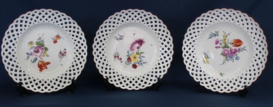 Three Meissen ribbon plates with hand painted floral decoration bearing the underglazed blue crossed - Image 2 of 3
