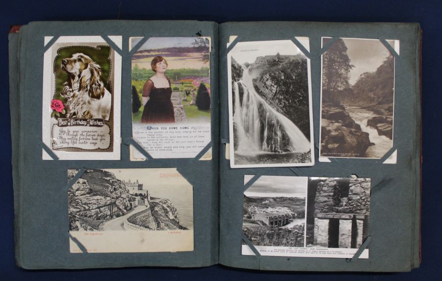 Postcard album containing approximately 225 topographical & greetings cards