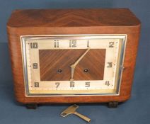 Art Deco gong striking mantel clock in a walnut case Ht 22cm L 30cm