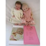 2 Reborn baby dolls 20" weighted baby with open eyes and brown hair and a 20" heavy weighted '