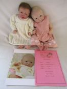 2 Reborn baby dolls 20" weighted baby with open eyes and brown hair and a 20" heavy weighted '