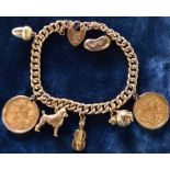 Charm bracelet (tested as 15ct gold) with padlock stamped 15ct  with 2 full sovereigns (1910 & 1912)