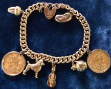 Charm bracelet (tested as 15ct gold) with padlock stamped 15ct  with 2 full sovereigns (1910 & 1912)