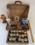 Small suitcase with contents to include wooden school rulers, vintage powder paints, Japanese