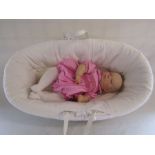 A reborn baby doll 24" very heavy weighted child size sleeping baby with moses basket