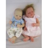 2 Reborn baby dolls 19" weighted doll with painted hair and open eyes and a heavy weighted doll with