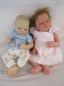 2 Reborn baby dolls 19" weighted doll with painted hair and open eyes and a heavy weighted doll with