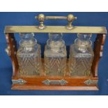 Victorian oak tantalus with 3 decanters - Daniel & Arter Birmingham lock plate