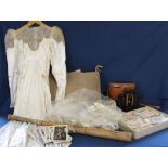 Vintage wedding dress, 1950s Wilson baseball bat, dressing table set with embroidered decoration,