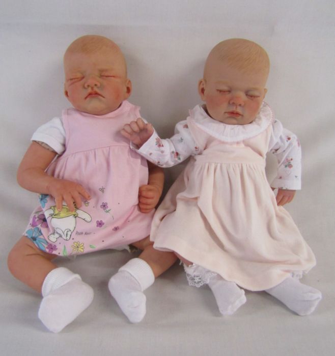 2 Reborn baby dolls 20" weighted doll with closed eyes and painted hair and a Romie Strydom head and