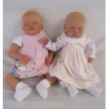 2 Reborn baby dolls 20" weighted doll with closed eyes and painted hair and a Romie Strydom head and