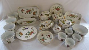 Royal Worcester 'Evesham' table ware to include serving dishes, flan dishes, cake plate, soufflé