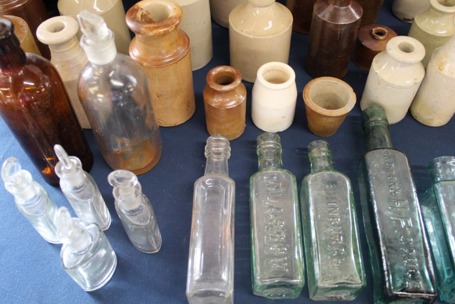 Large selection of salt glazed bottles, 2 large brown glass bottles & clear glass sauce bottles etc. - Image 3 of 3