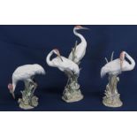 Trio of Lladro stork figurines on naturalistic bases (end of one beak  / bull rushes damaged)