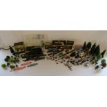 Collection of N gauge railway track and accessories to include carriages, trees, people, cars,