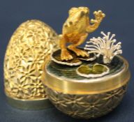 Stuart Devlin limited edition silver gilt "Surprise" egg, the two section textured and engraved