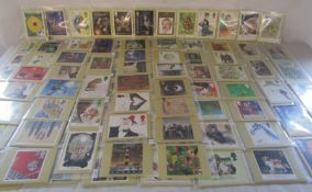 Large collection of Royal Mail stamp postcard series - most pouches holding several cards