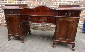 Large early 20th century mahogany sideboard in the Chippendale style on twin pedestals with ball &