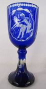 Bohemian blue glass wine glass with etched erotic scene