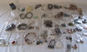 Mixed collection of individually bagged costume jewellery and a Zippo lighter