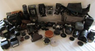 Large collection of cameras including Fuji Finepix 7000, Voighlander, Pocket Ensign, Makinon lens,