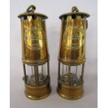 Pair of Eccles brass protector lamp and lighting safety lamps approx. 25cm