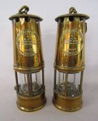 Pair of Eccles brass protector lamp and lighting safety lamps approx. 25cm