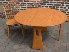 Modern Ercol Windsor gate leg table in ash (RRP £1540) with an Ercol spindle back chair (RRP £450)