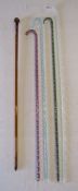 5 glass canes - clear glass walking cane containing red white and blue spiralling, pale green