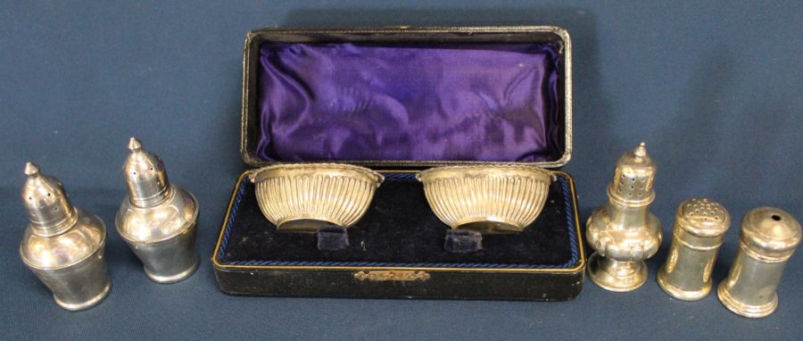 Pair of cased silver salts Birmingham 1910, pair of sterling weighted pepperettes, silver pepper