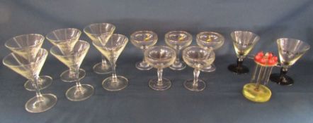 Collection of cocktail glasses, Babycham glasses and olive forks on stand