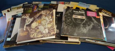 Approximately 64 vinyl LP's including Genesis, Jefferson Airplane, Fleetwood Mac, Grace Slick,