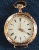 Continental gold open face top wind fob / wrist watch marked 0.585, with floral decoration to back