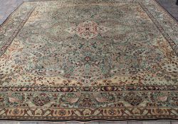 Large wool carpet on green ground 369cm x 318.5cm