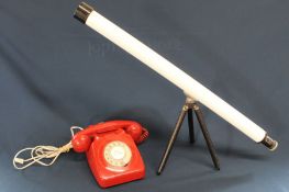 Vintage red rotary telephone with modern wiring & child's telescope