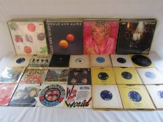 Selection of 7" and 12" vinyl records including the Beatles,  The Kinks, Elton John, Carpenters,